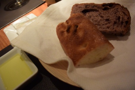 Bread served with the fish- red-wine grape bread and focaccia with Spanish olive oil and salt.