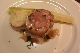 Lamb with various herbs wrapped in fat with onion and young corn, anchovy sauce.