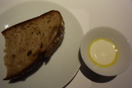 The delicious, soft, warm bread is served with a tofu and sour cream spread with a touch of olive oil.