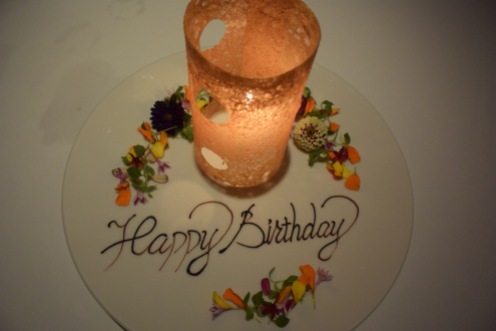 A kind of late birthday celebration came with this very pretty plate. The edible candle is orange flavored.
